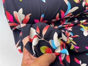 Polyester jersey - sort bund med flotte blomster